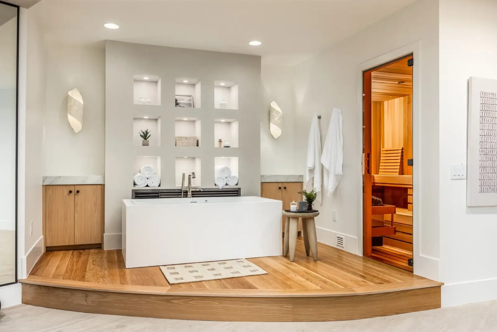 The Oasis Utah — Spa-style bathroom with tub and wood finishes