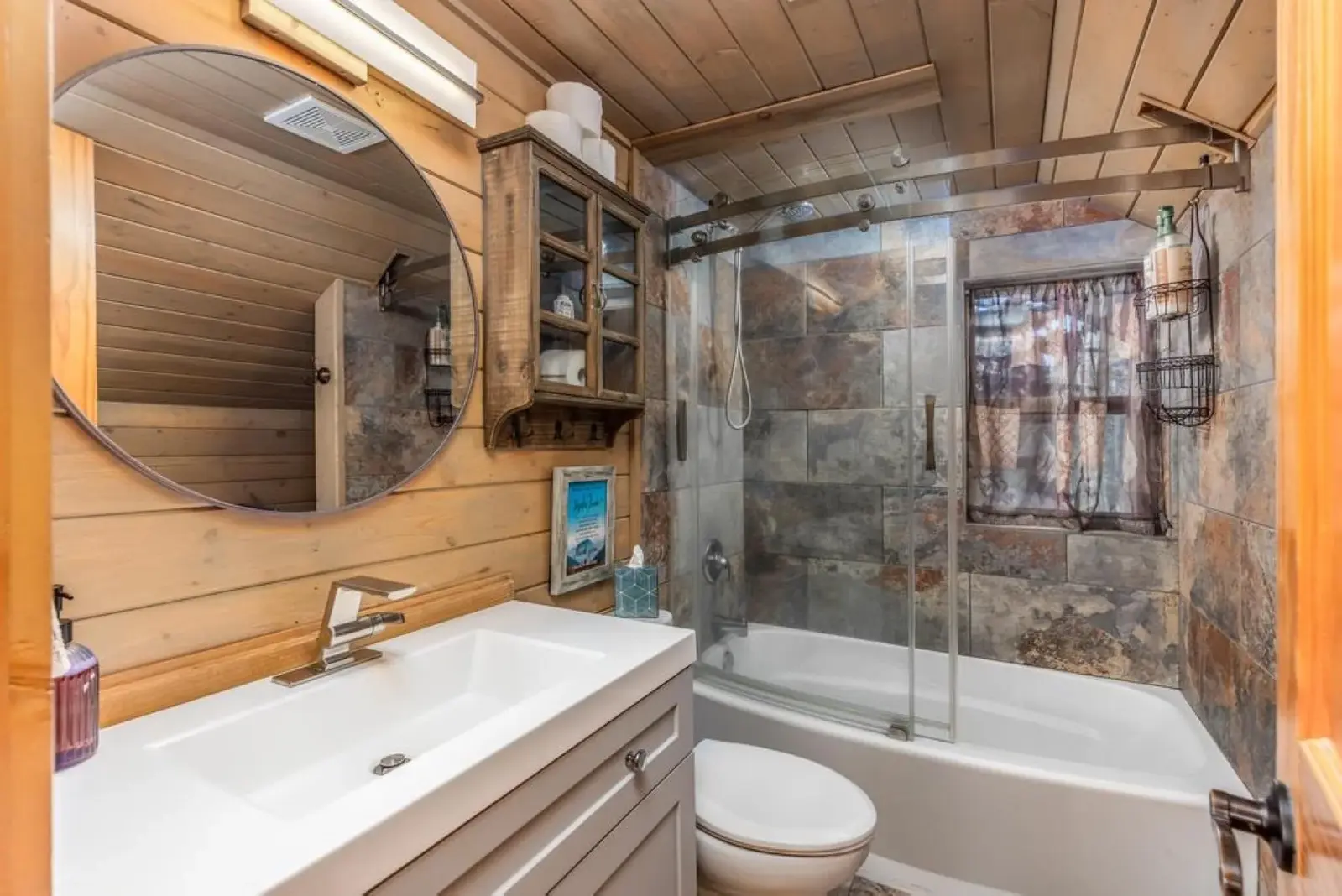 Brian Head — Cabin bathroom with glass shower and timber finishes