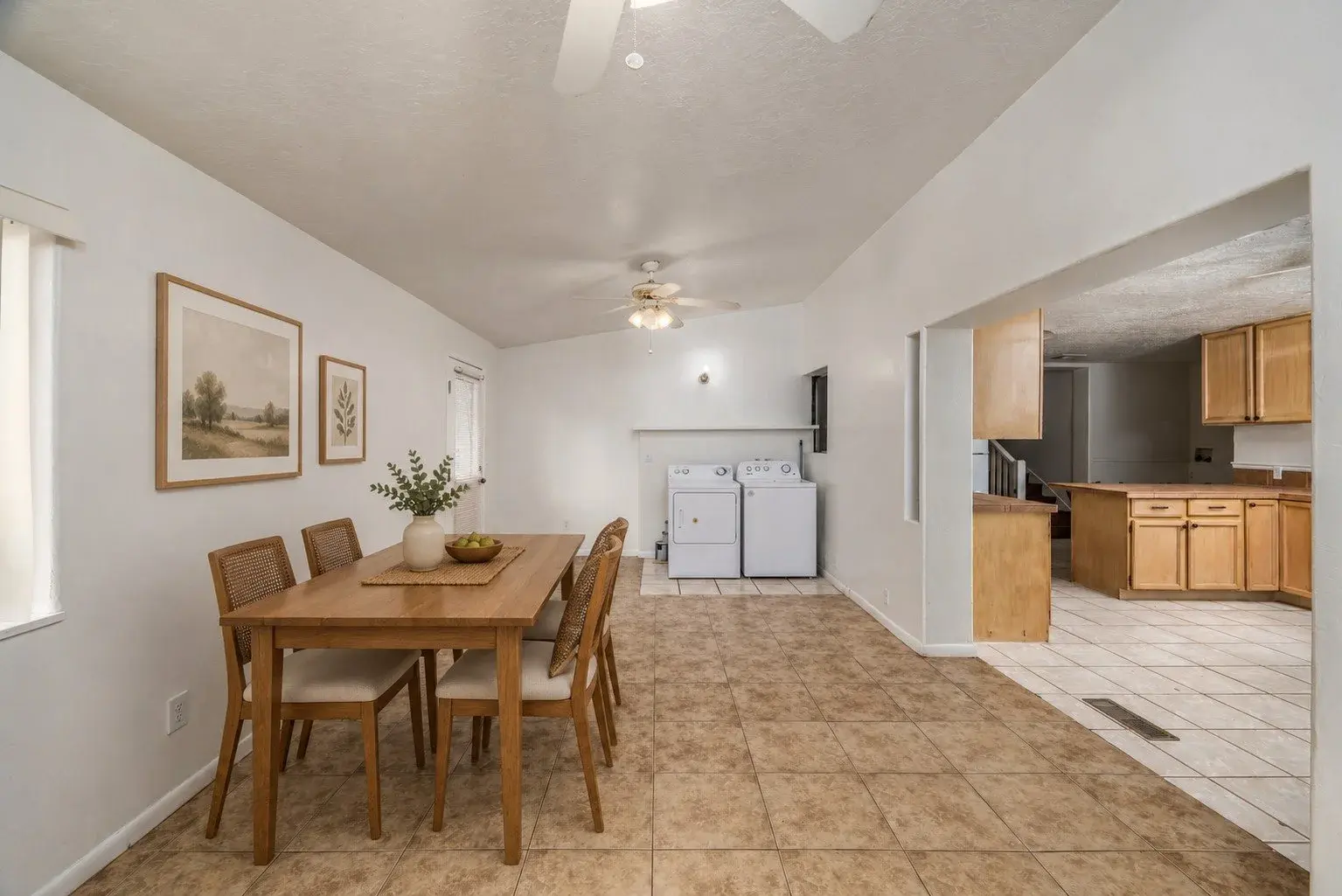 Virtually staged dining area with digitally added furniture and decor