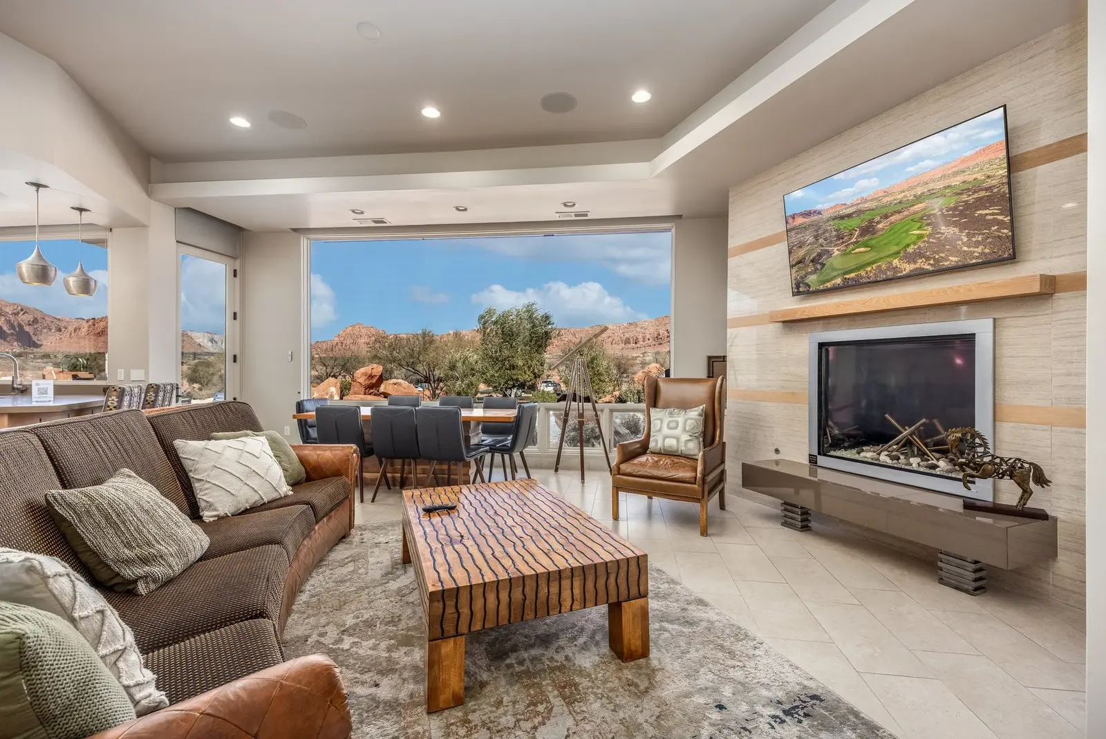 Bright living and dining space overlooking red-rock scenery at The Inn at Entrada