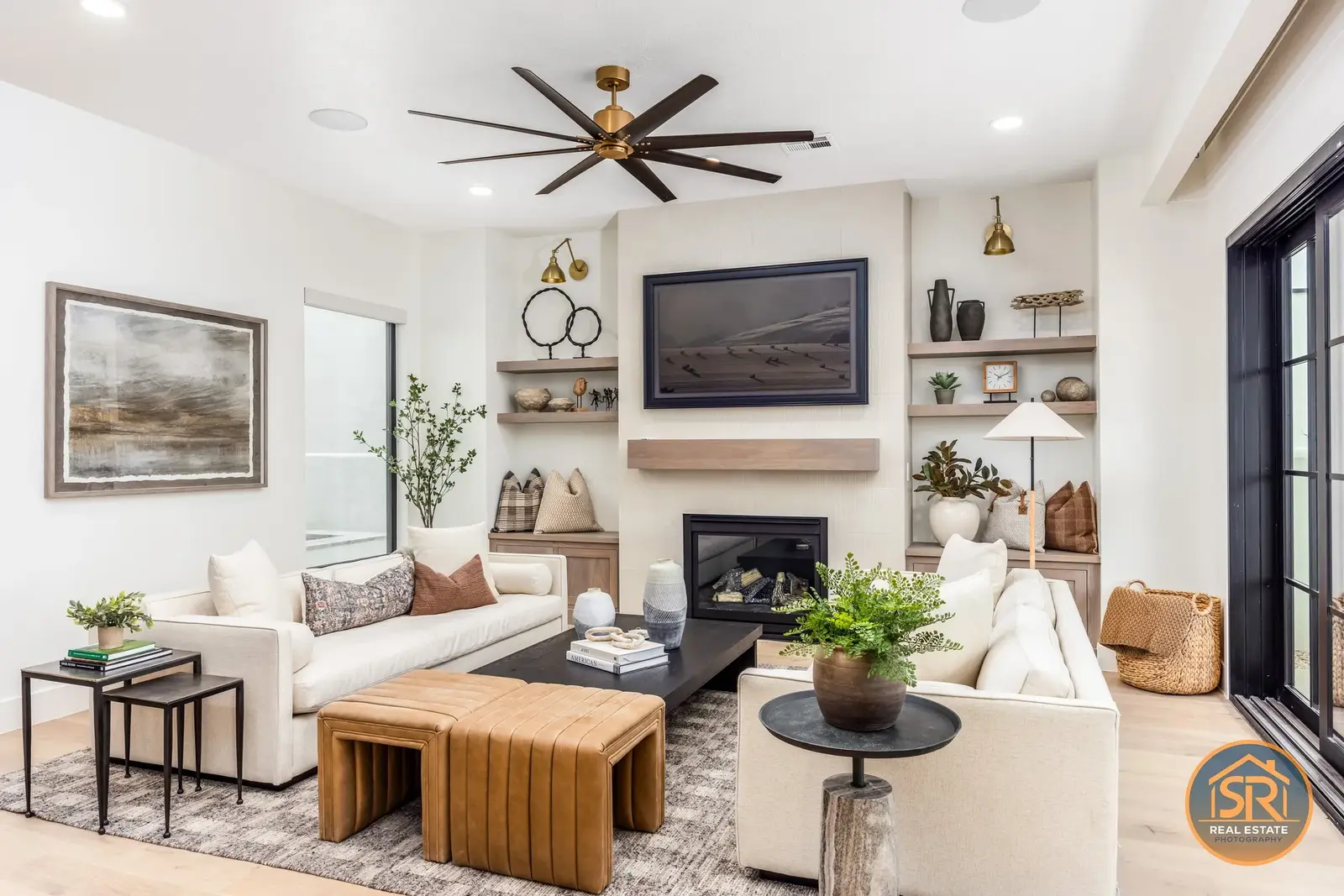 Bright living room with pale sofas and a fireplace — from Sam Reed’s photography portfolio