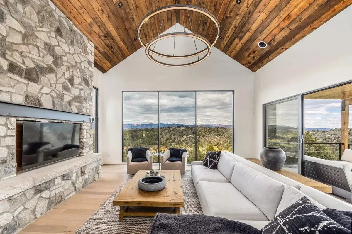 Bright nightly rental living room with mountain views photographed by Sam Reed
