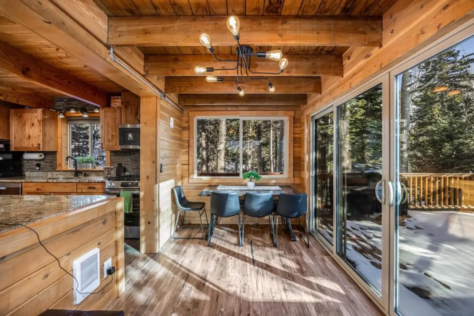 Brian Head — Timber dining nook beside glass doors