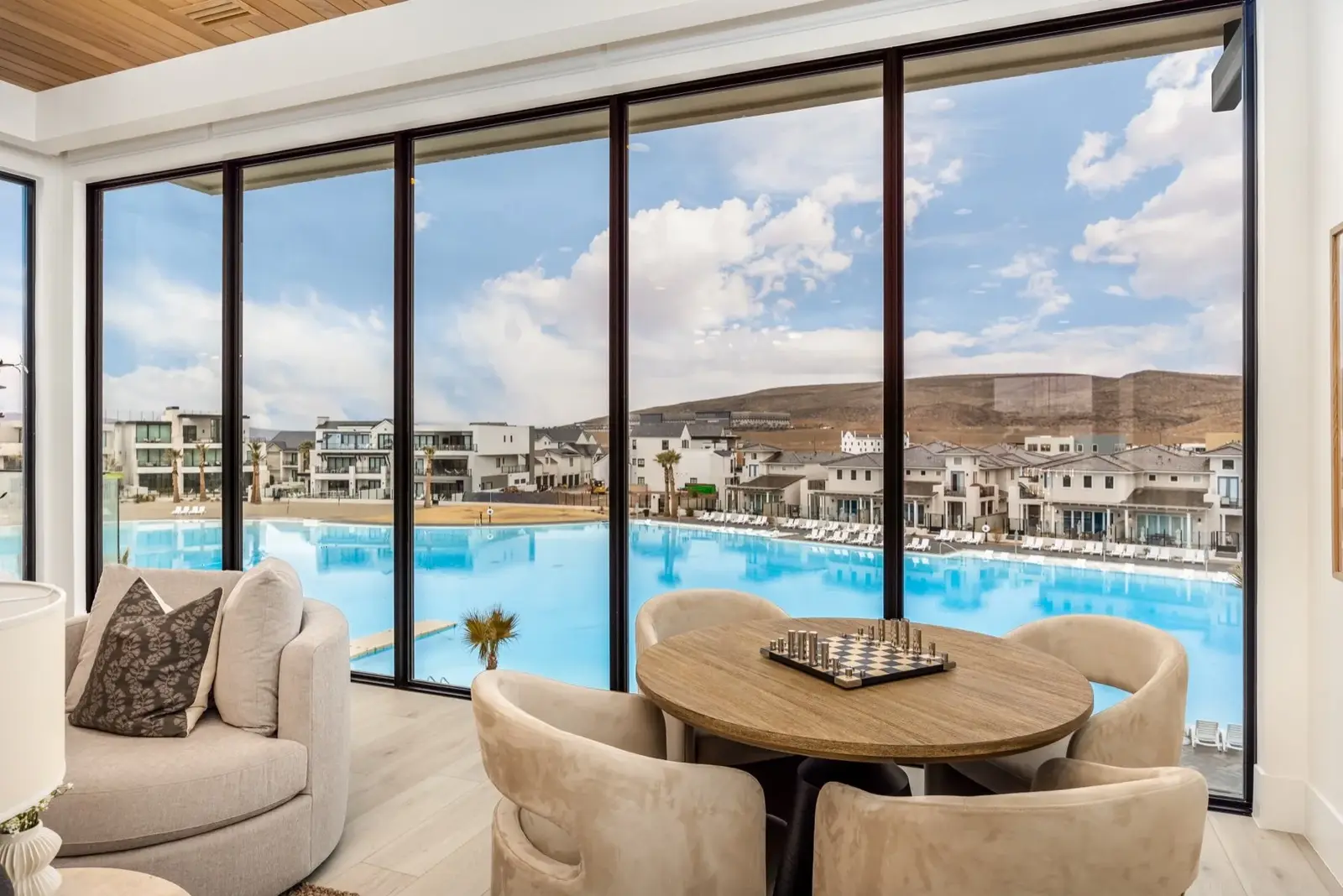 The Oasis Utah — Lounge seating overlooking turquoise lagoon water