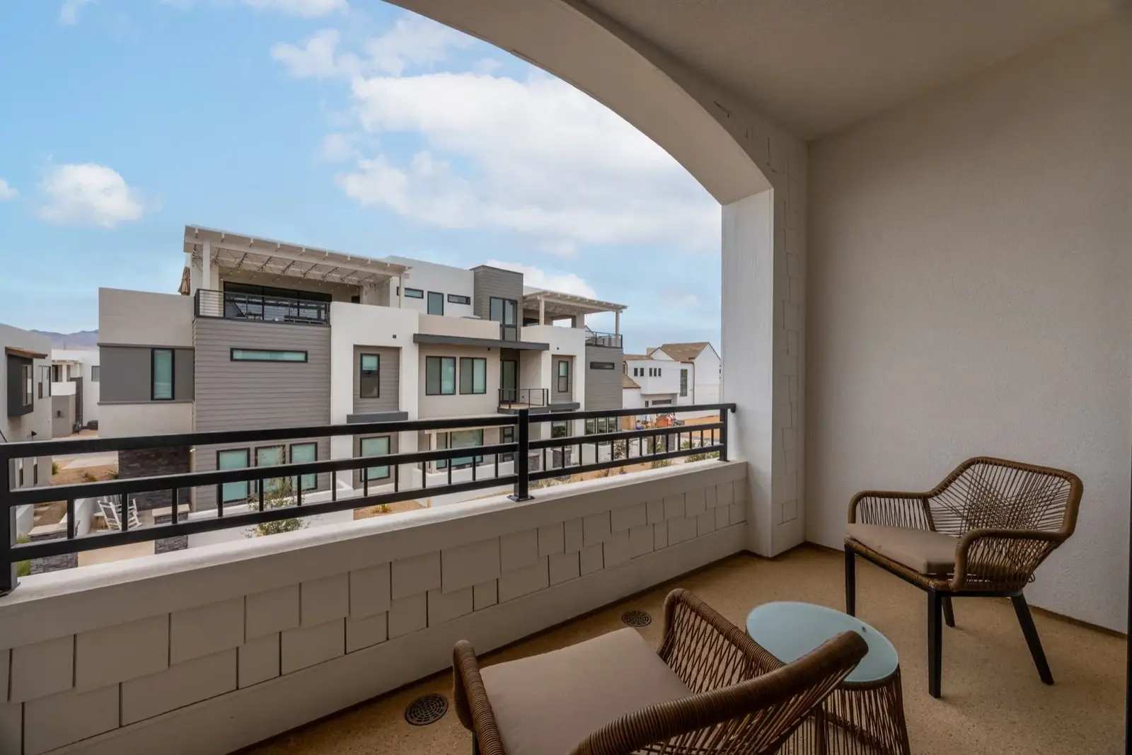 Lula Bay — Covered balcony with woven seating
