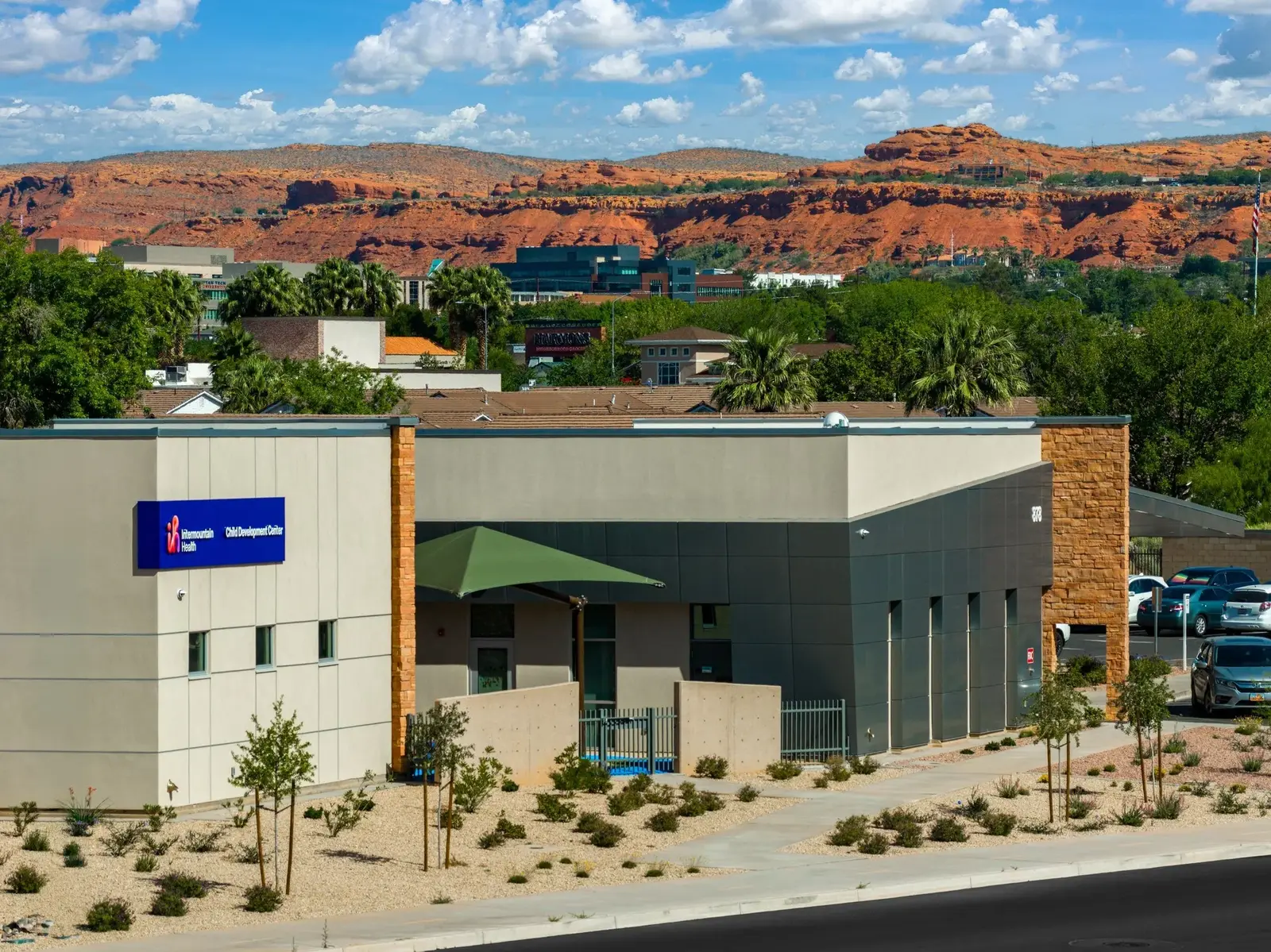 Intermountain Child Development Center set against distant red-rock cliffs.