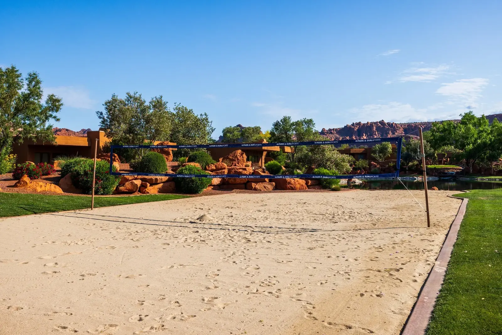 Sand volleyball court with desert landscaping at Entrada