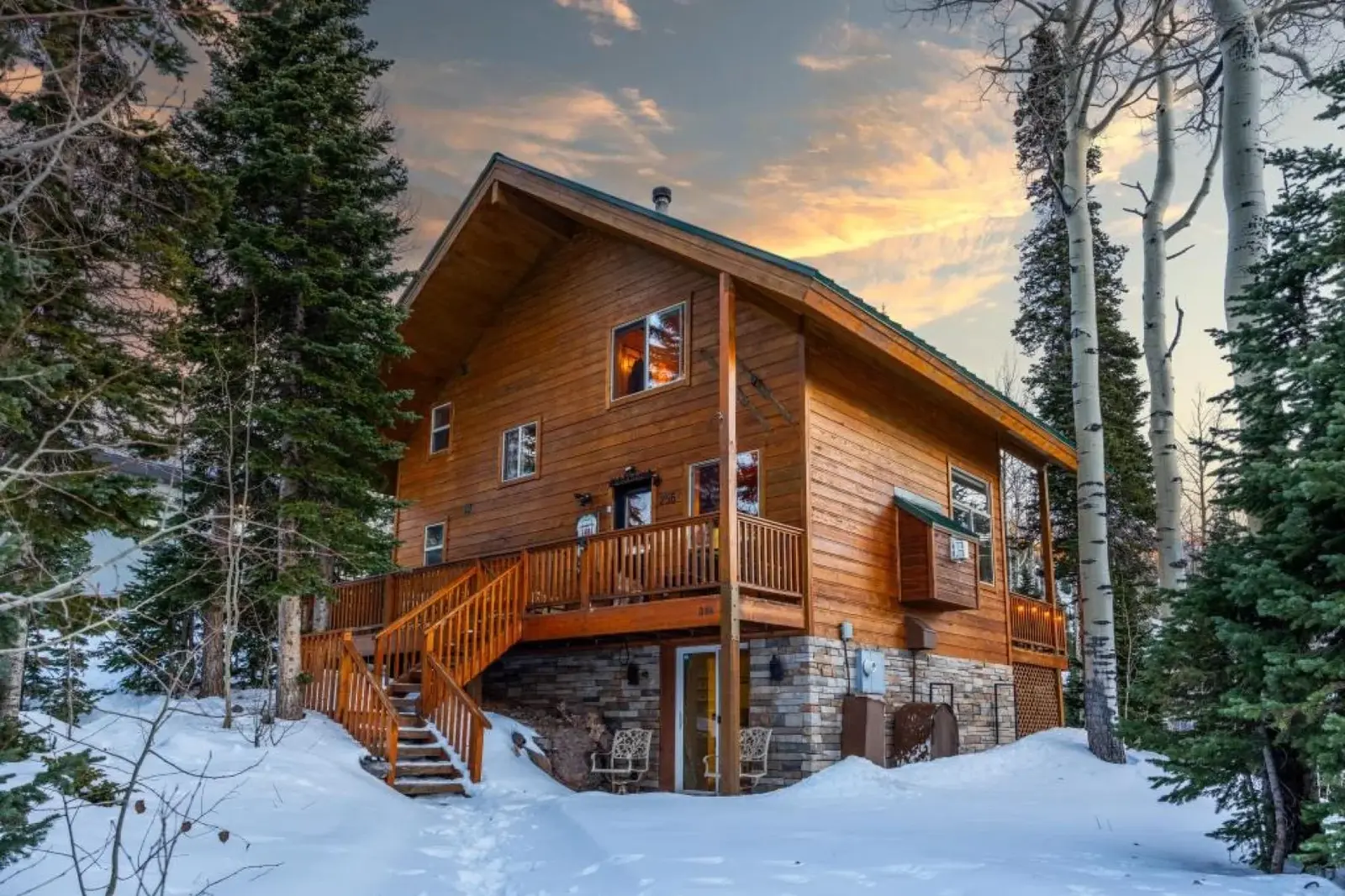 Brian Head — Snow-covered cabin exterior at sunset