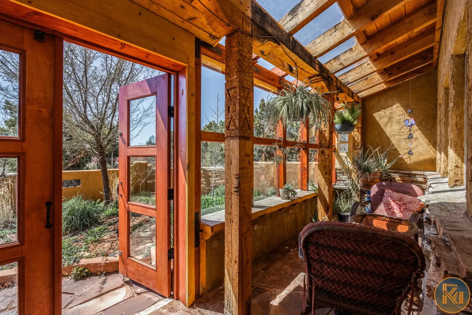 Timber-framed sunroom with glass roof panels and a garden door — from Sam Reed’s photography portfolio