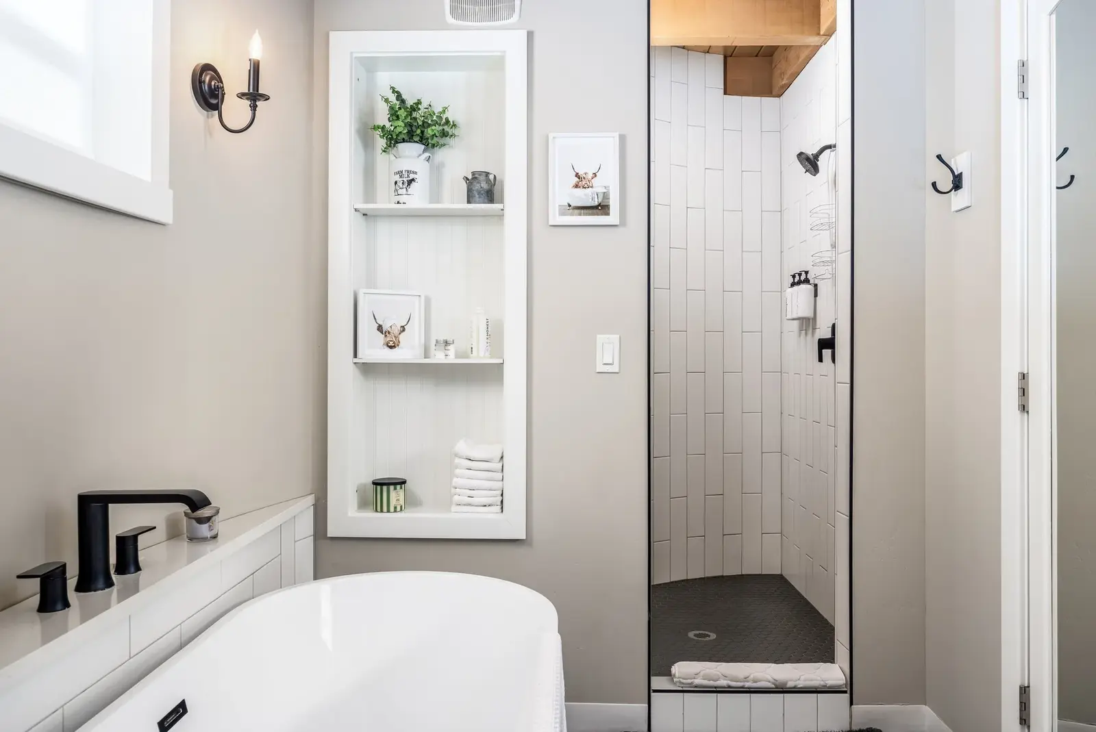 Bathroom with a freestanding tub and shower at The Silo Suites
