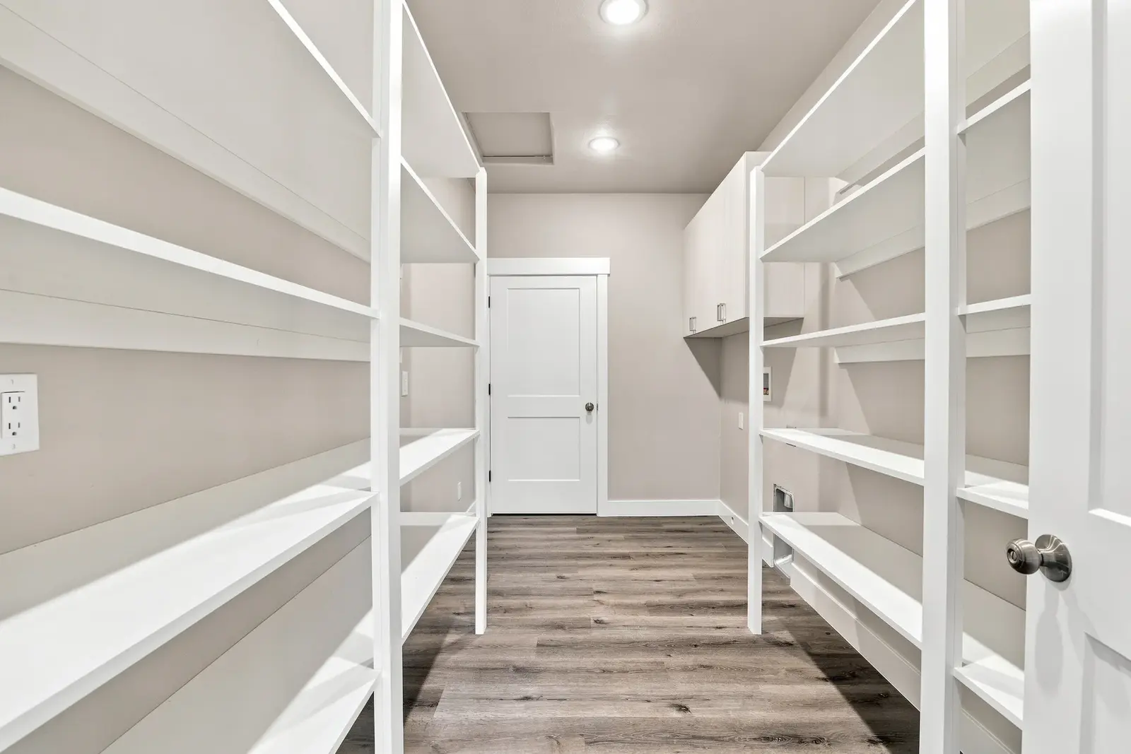 Walk-in closet with built-in white shelving